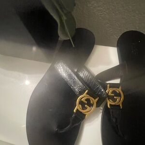 Gucci Black Slides with Gold Emblem